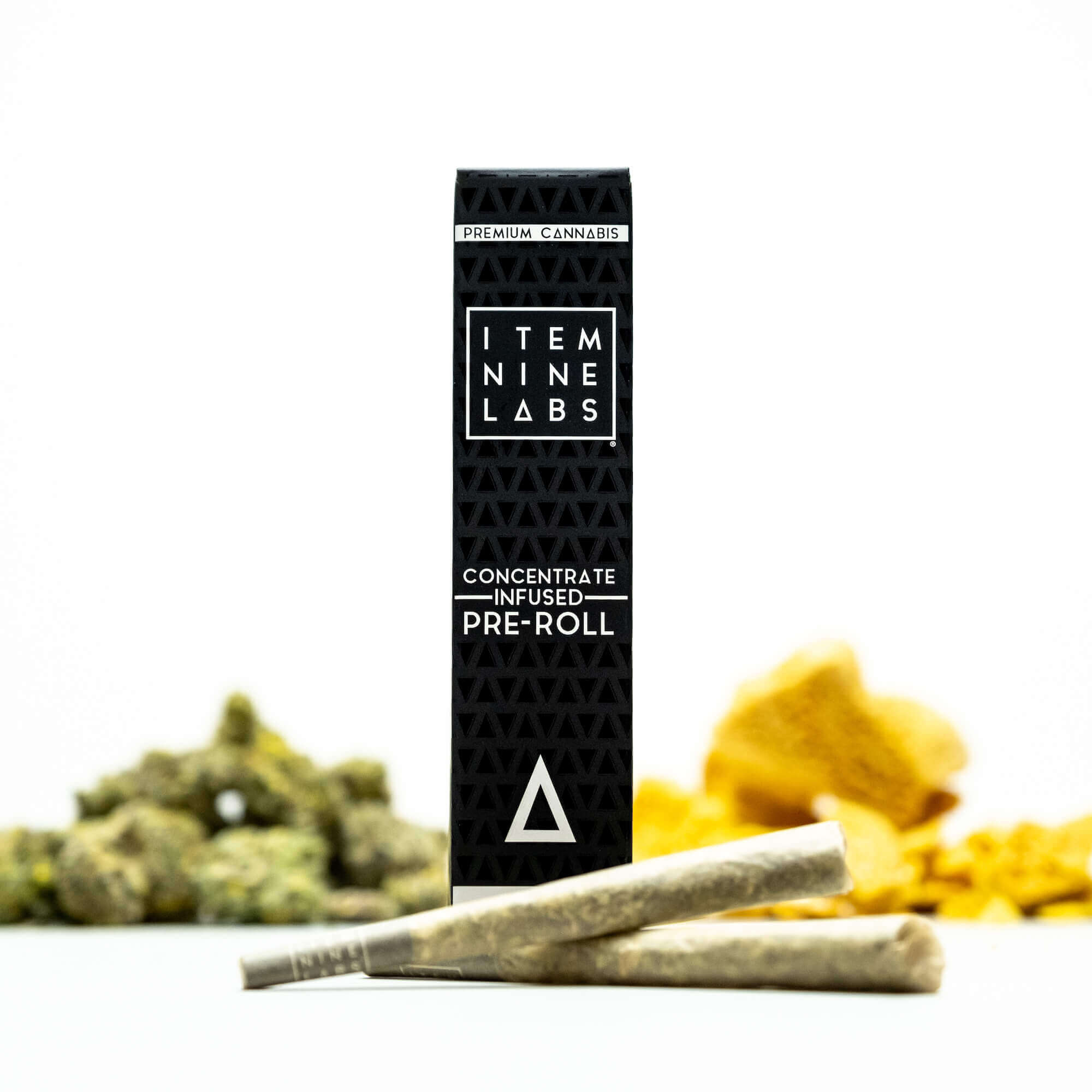 item nine labs infused pre roll joints and packaging with marijuana flowers and live resin sitting behind the pre rolls